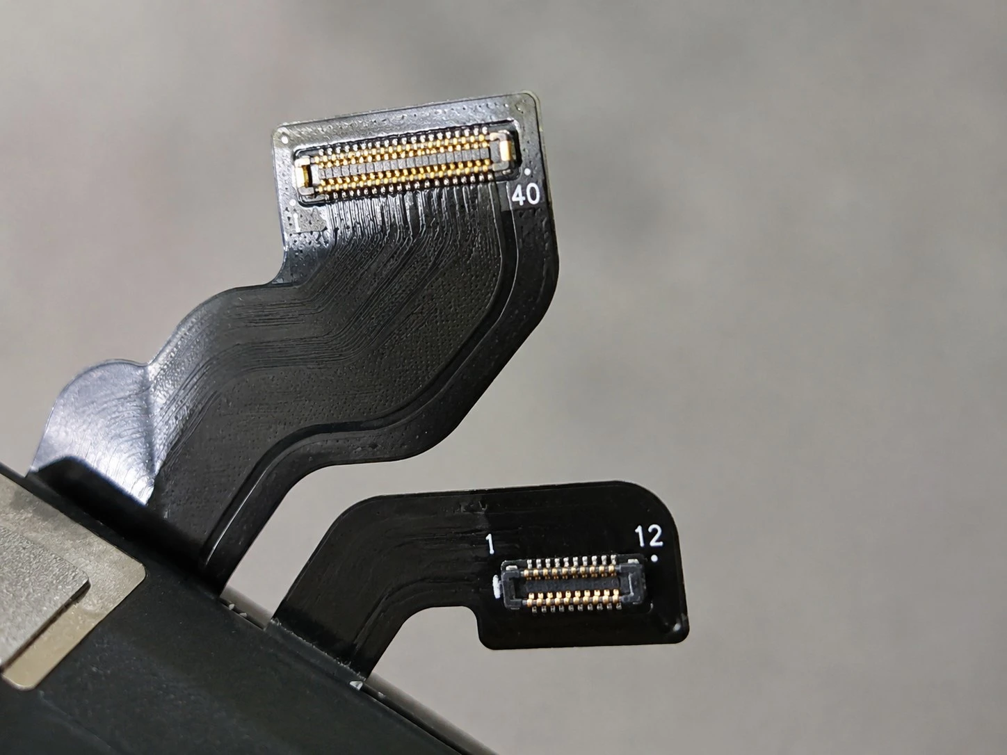Close-up of an iPhone display flex cable and connector Close-up of an iPhone display flex cable and connector